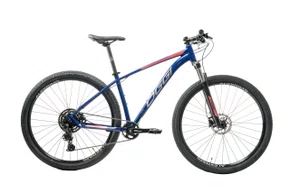 Bicicleta Oggi Aro 29 BW 7.0 Cues 9V Azul/Vermelho 15,5 2026